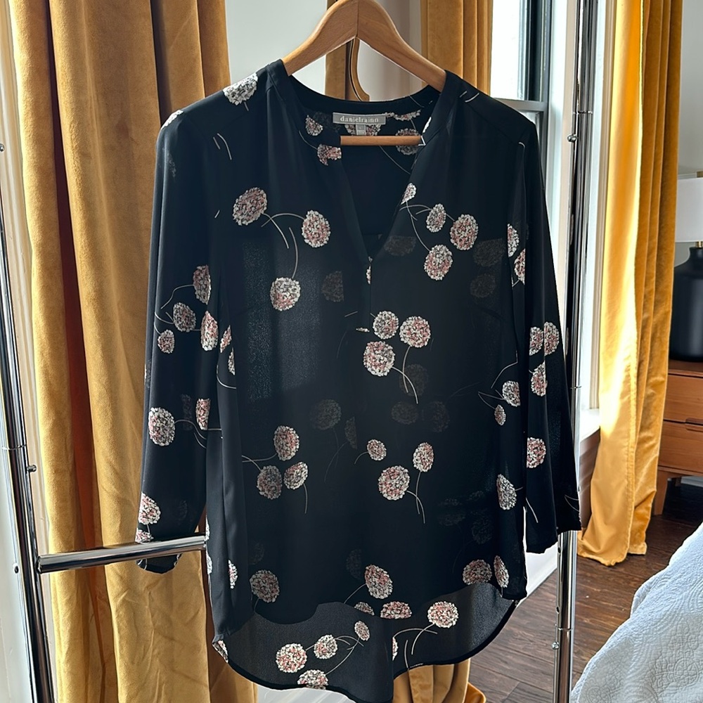Size large Sheer black blouse with flower design.